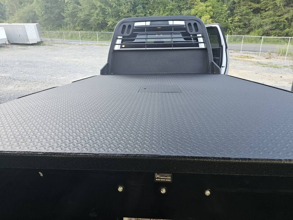 View across a coated work-truck flatbed deck